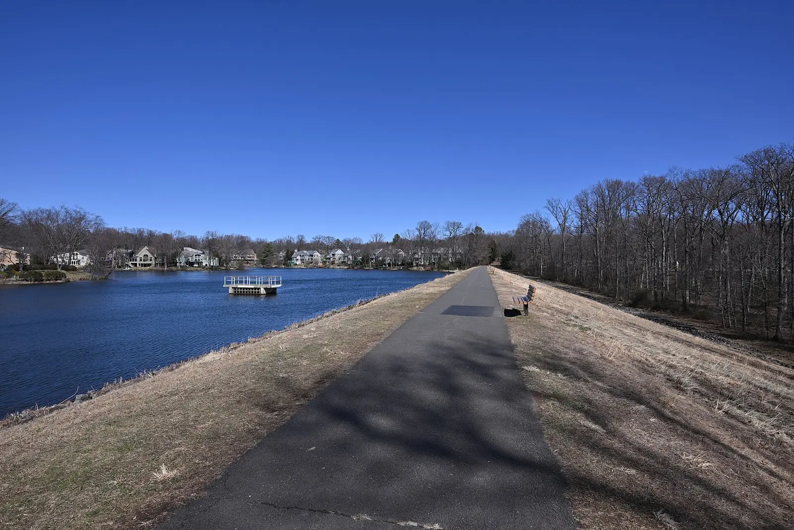 The paved path along the Lake Newport dam at Brown's Chapel Park in Reston