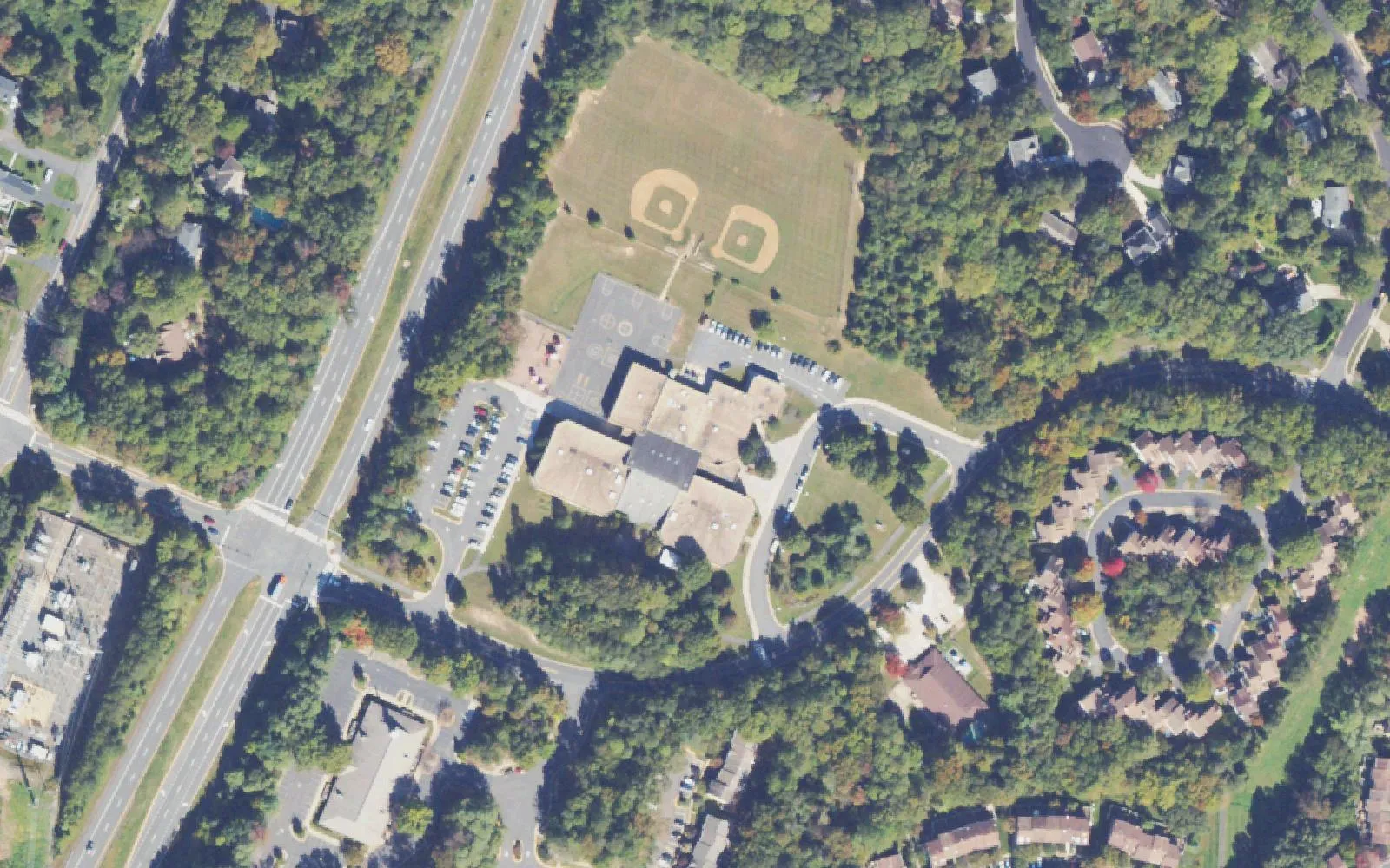 Armstrong Elementary School on Lake Newport Road in north Reston, with its ball fields behind the building, seen from the air