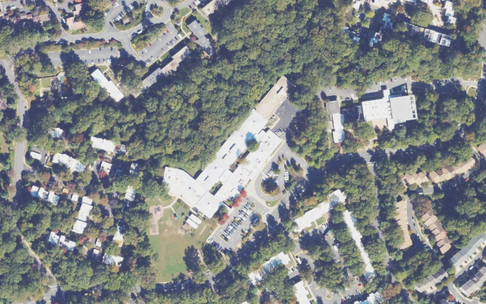 Lake Anne Elementary School on North Shore Drive in Reston, with the townhouses and apartments around it, seen from the air