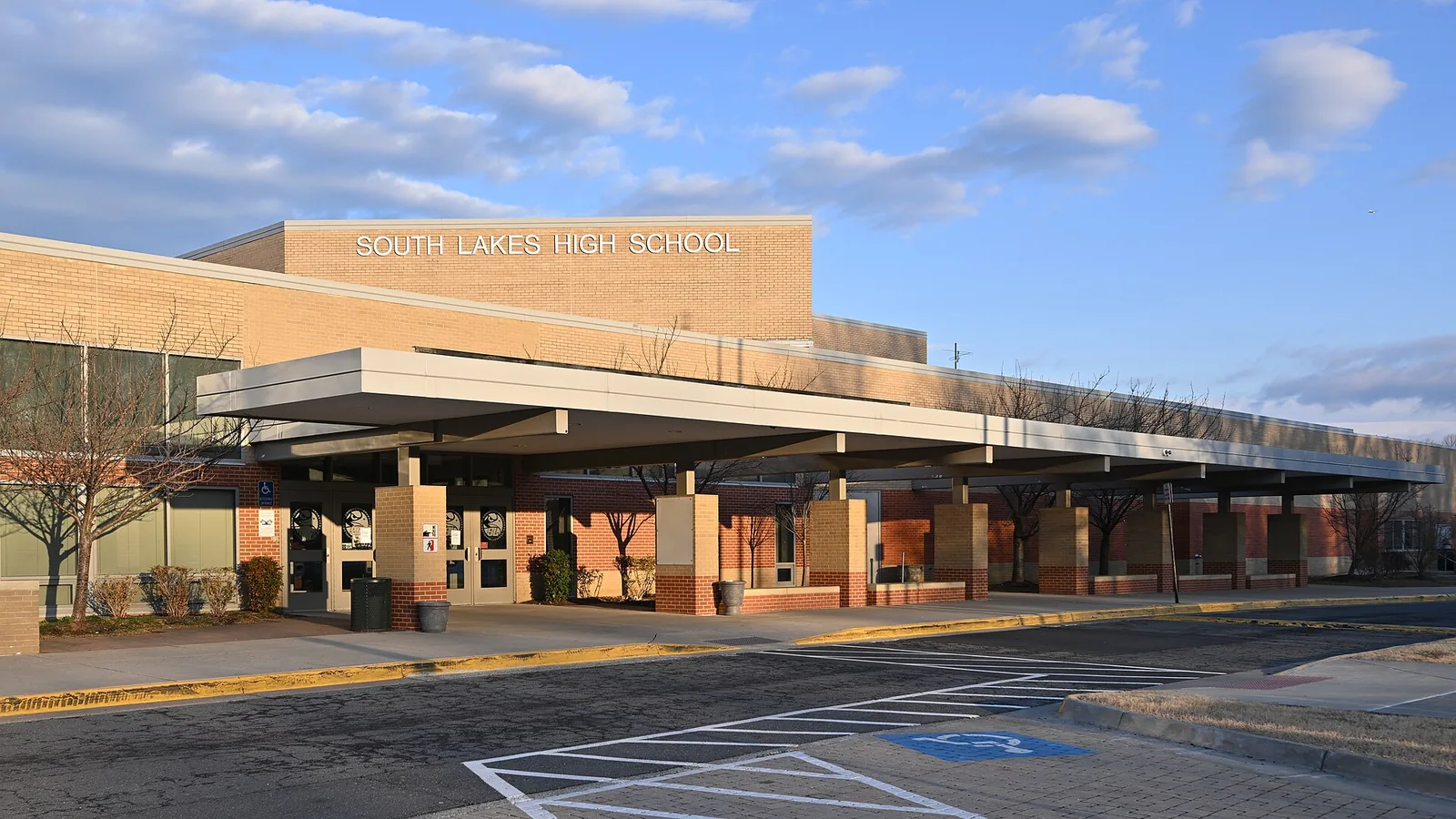 The front entrance and covered walkway of South Lakes High School on South Lakes Drive in Reston
